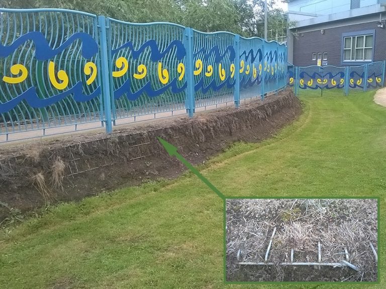 Rubber Grass Mats Covering A Soil Bank - Before Grass Mats Installed w Close Up