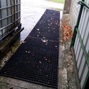 Grass Mats Installed For A Non-Slip Path Over Concrete For Ponies