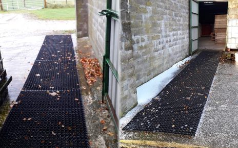 Grass Mats Used To Create A Non-Slip Path Over Concrete For Ponies - Featured Image
