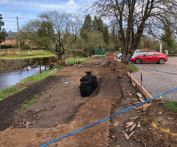 Soil Excavated & X-Grid Being Installed and Filled - From Side